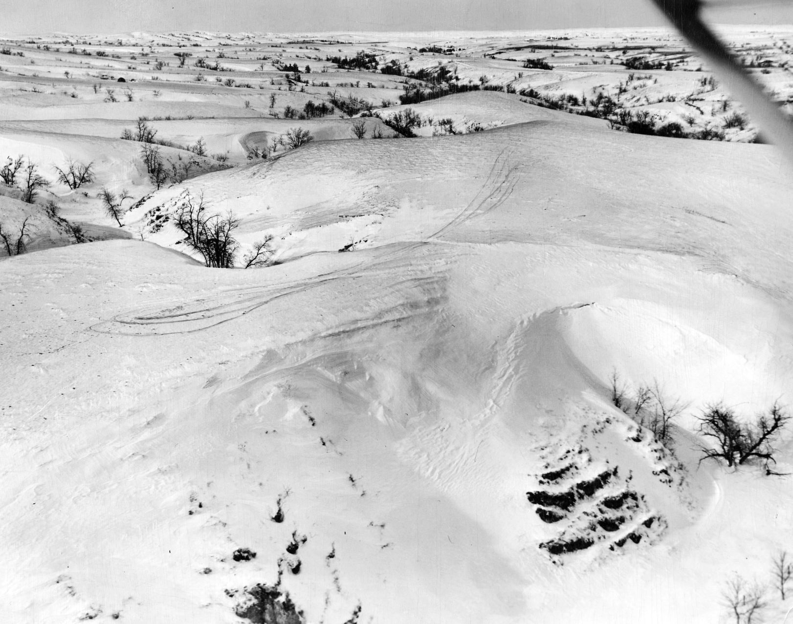 Pilot Joe M. Poland landed his plane on this hilltop to carry supplies to the stranded Harold Anderson family. Published Feb. 6, 1949.